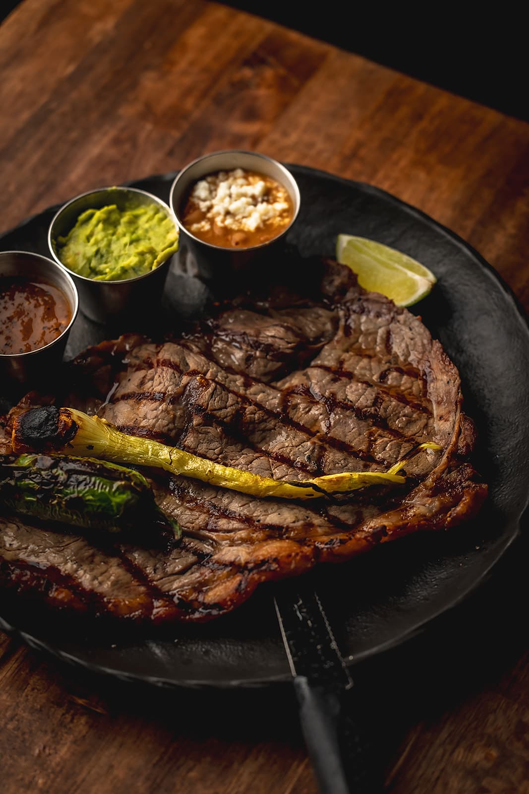 Carne asada with grilled vegetables and house salsas