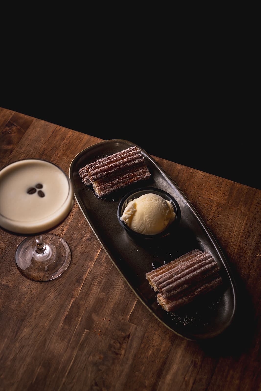 Cajeta-filled churros with chocolate and ice cream