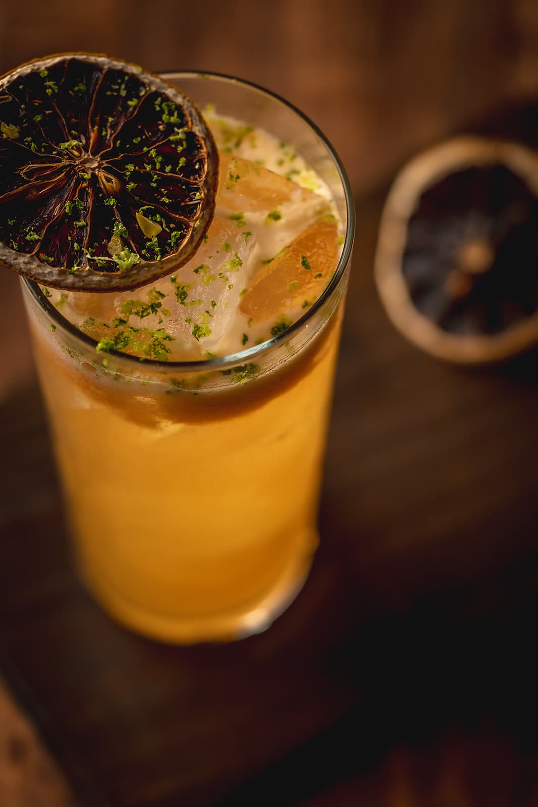 Colibrí cocktail with passion fruit garnish