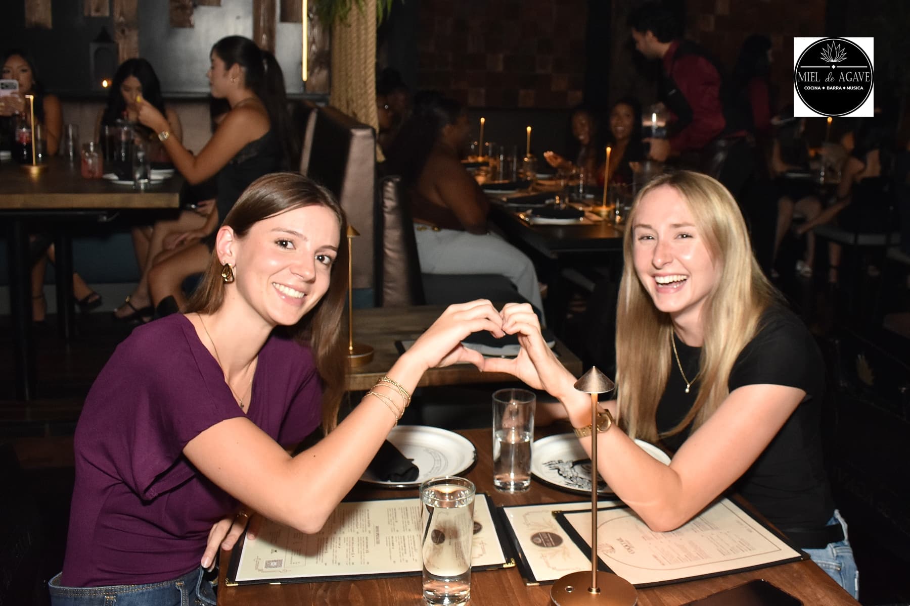 Two guests enjoying a night out at Miel de Agave