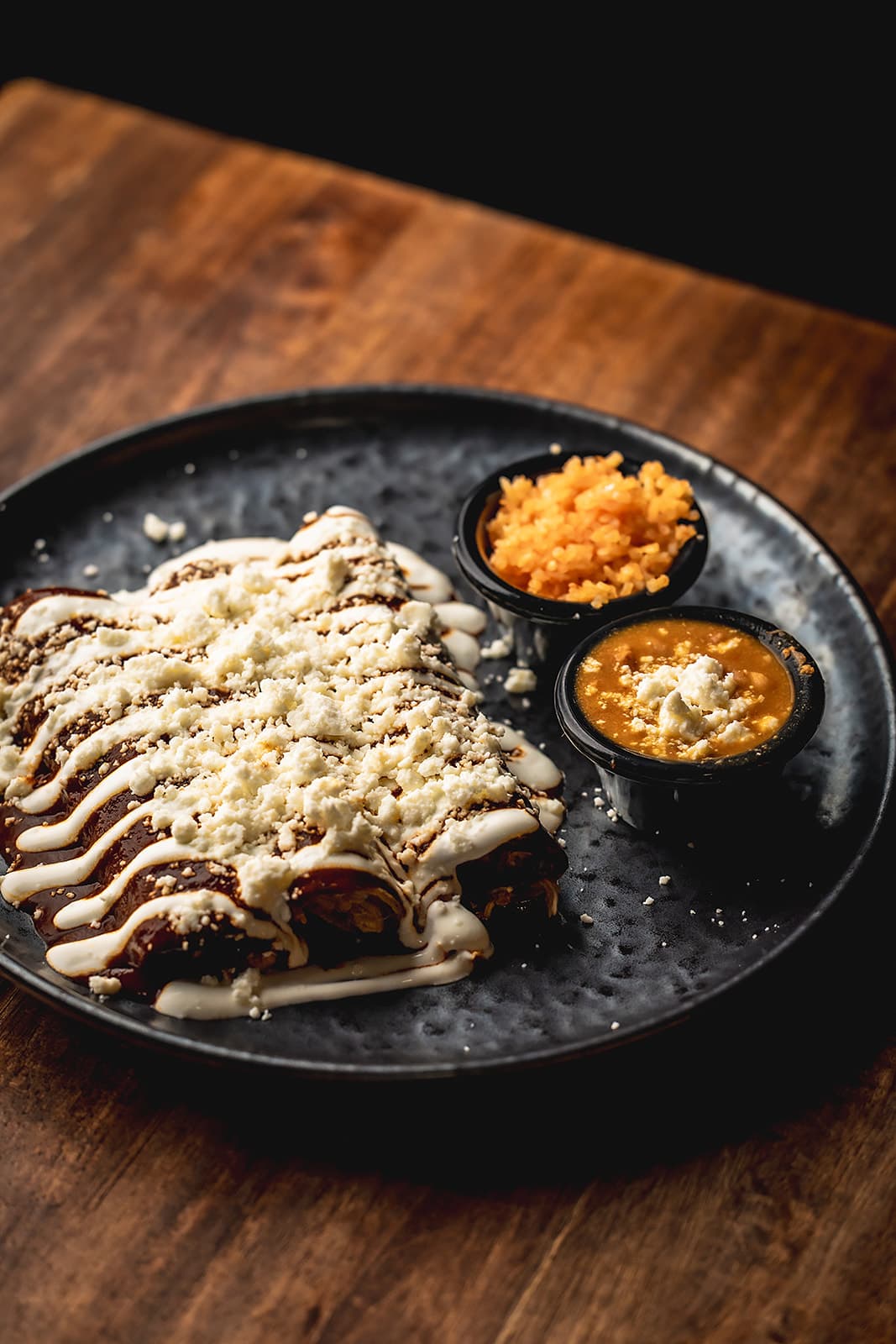 Mole enchiladas with crema and queso fresco